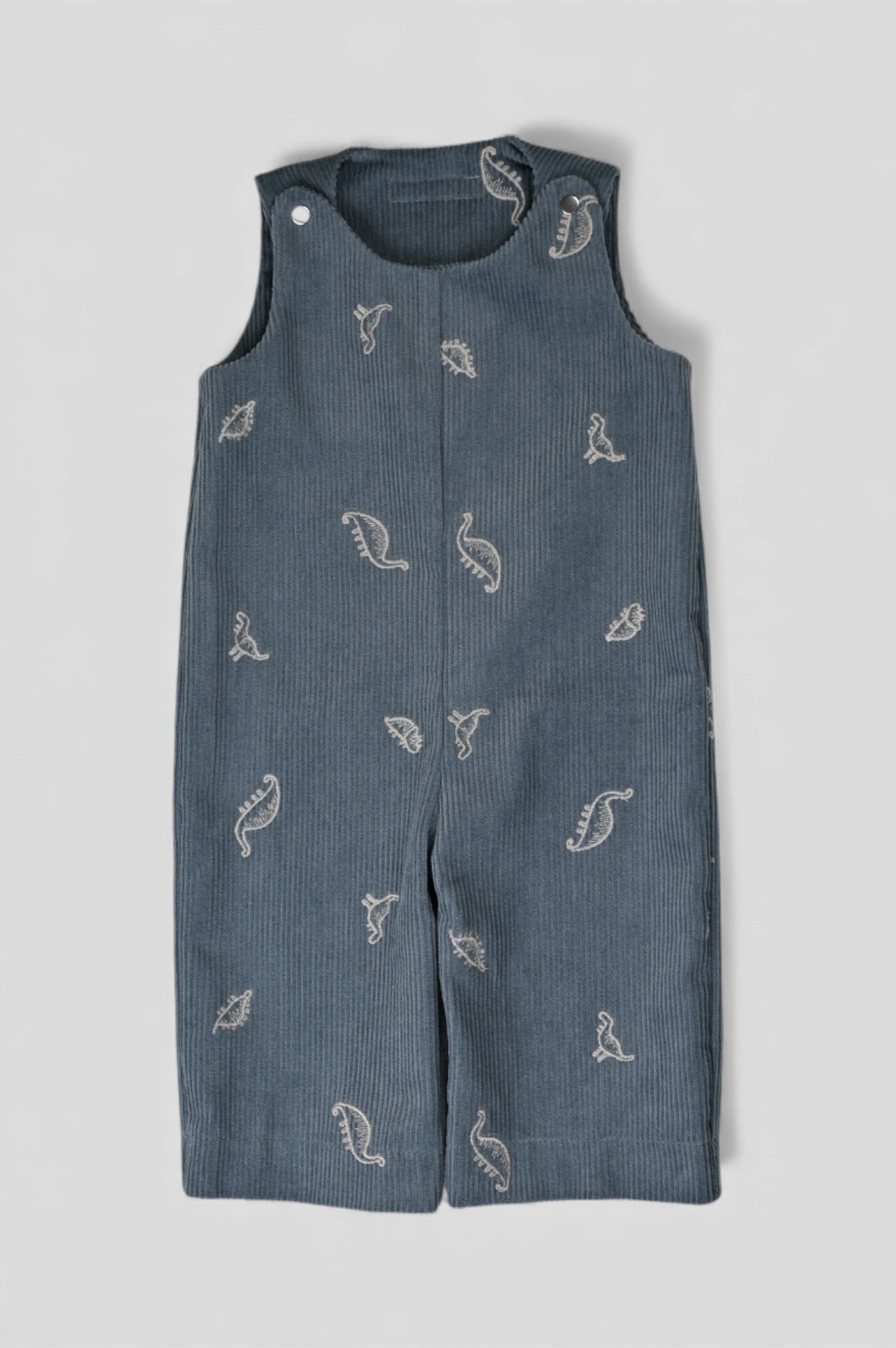 Kamping Studios Baby Overall und Strampler aus Cord mit Dinosauriern, Produktfoto, Vorderseite