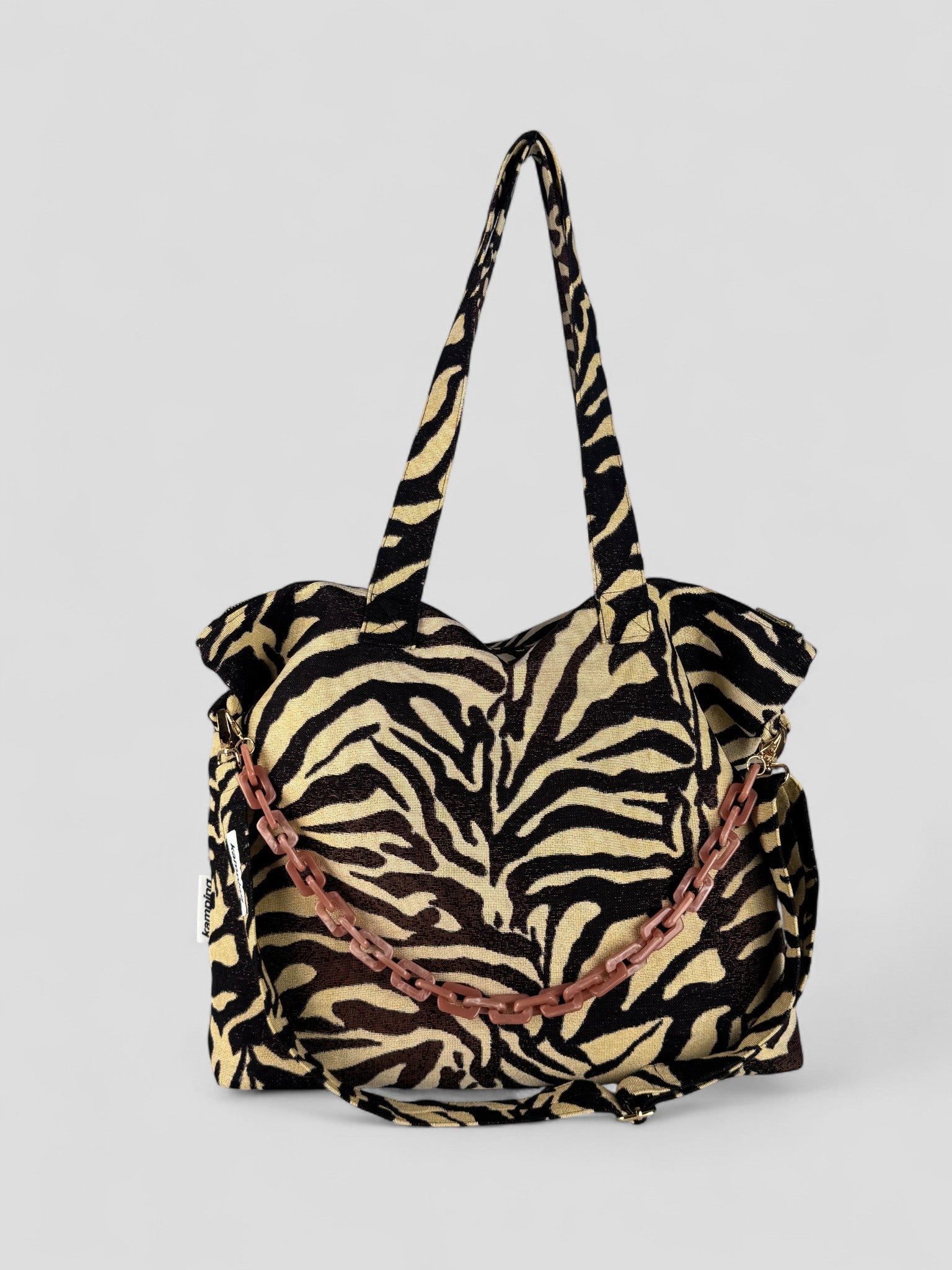 Kamping Studios Shopper zebra-muster, Produktfoto, Vorderansicht mit rosa Kette und Gurt